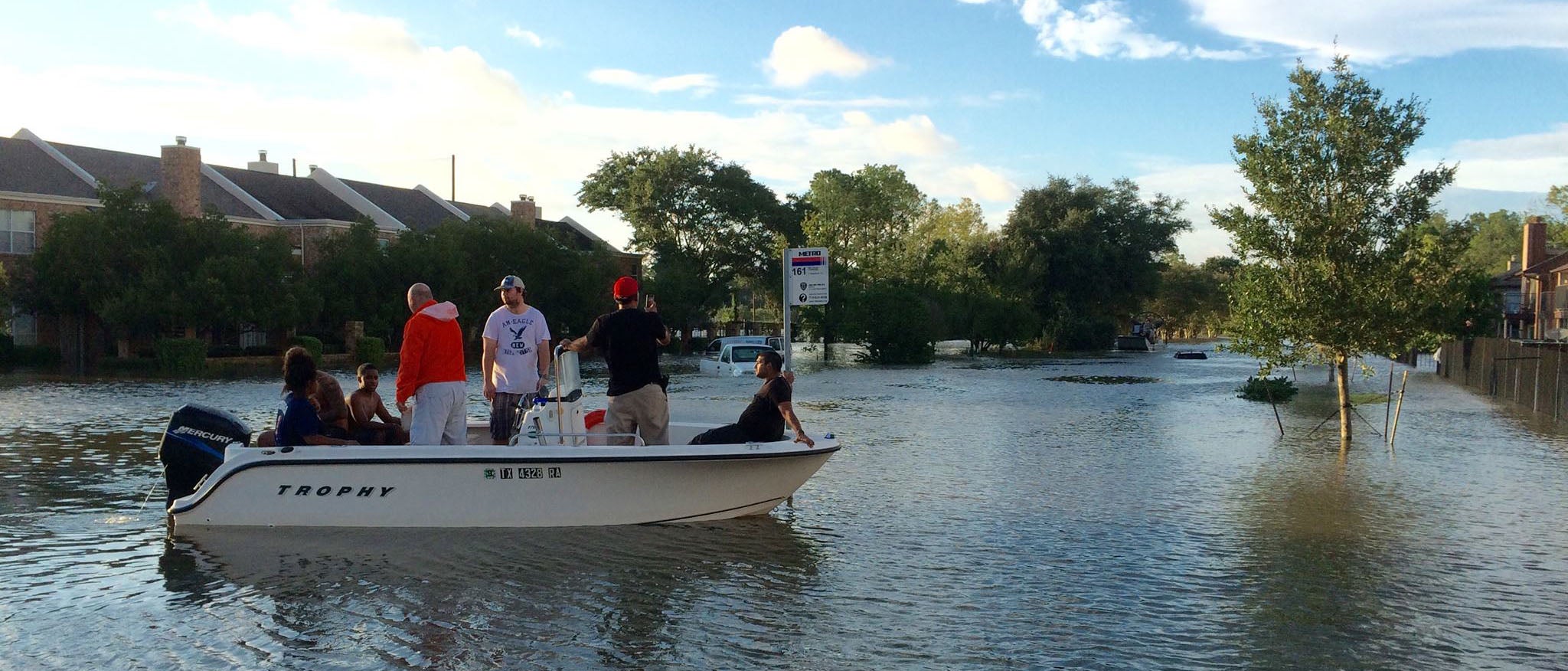 people evacuating in boat
