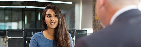 Woman speaking to colleague