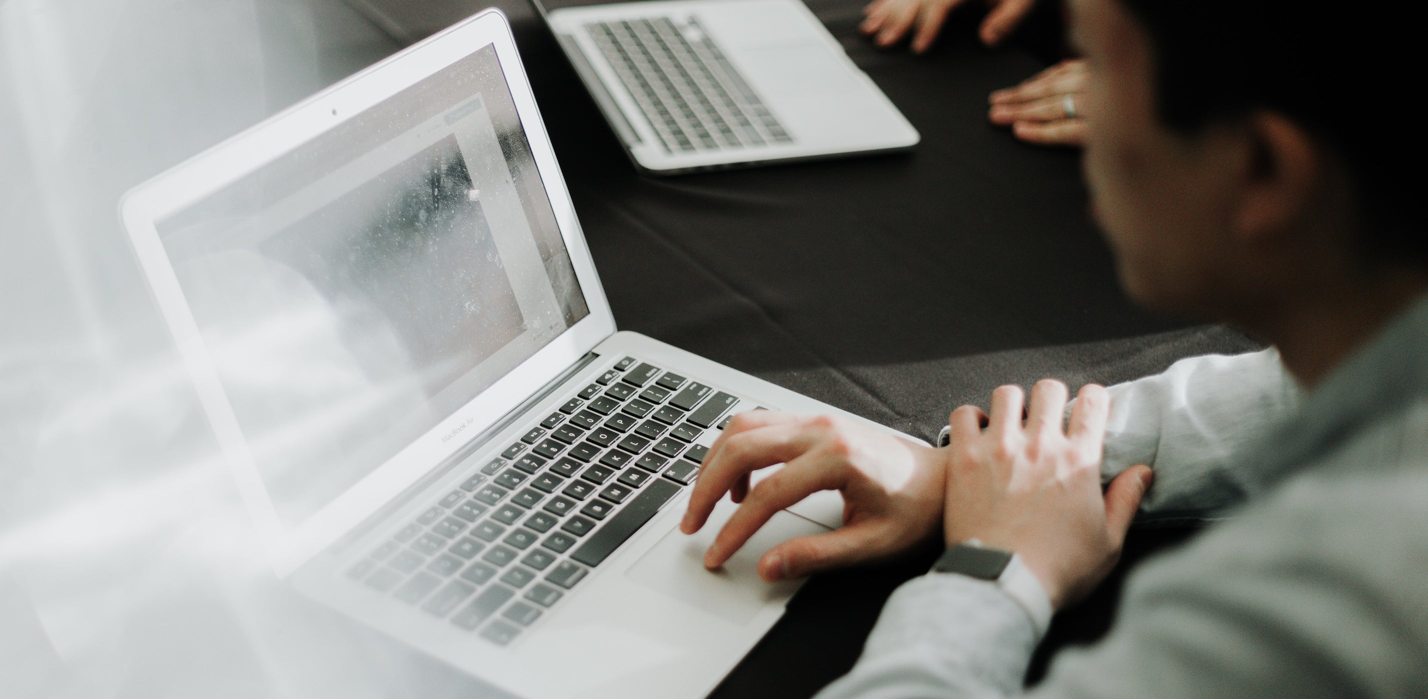 Young professional looking at computer screen