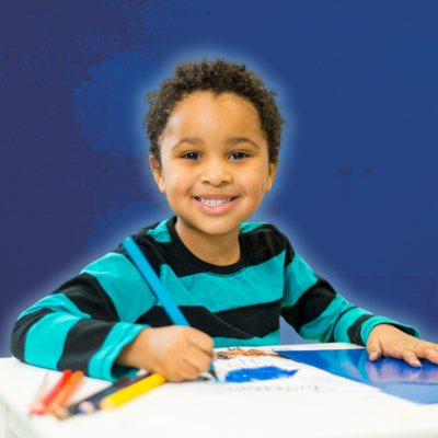 Young student enjoying art lesson.
