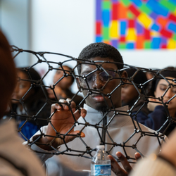 Student working through a hands-on activity at an AP STEM event at Rice.
